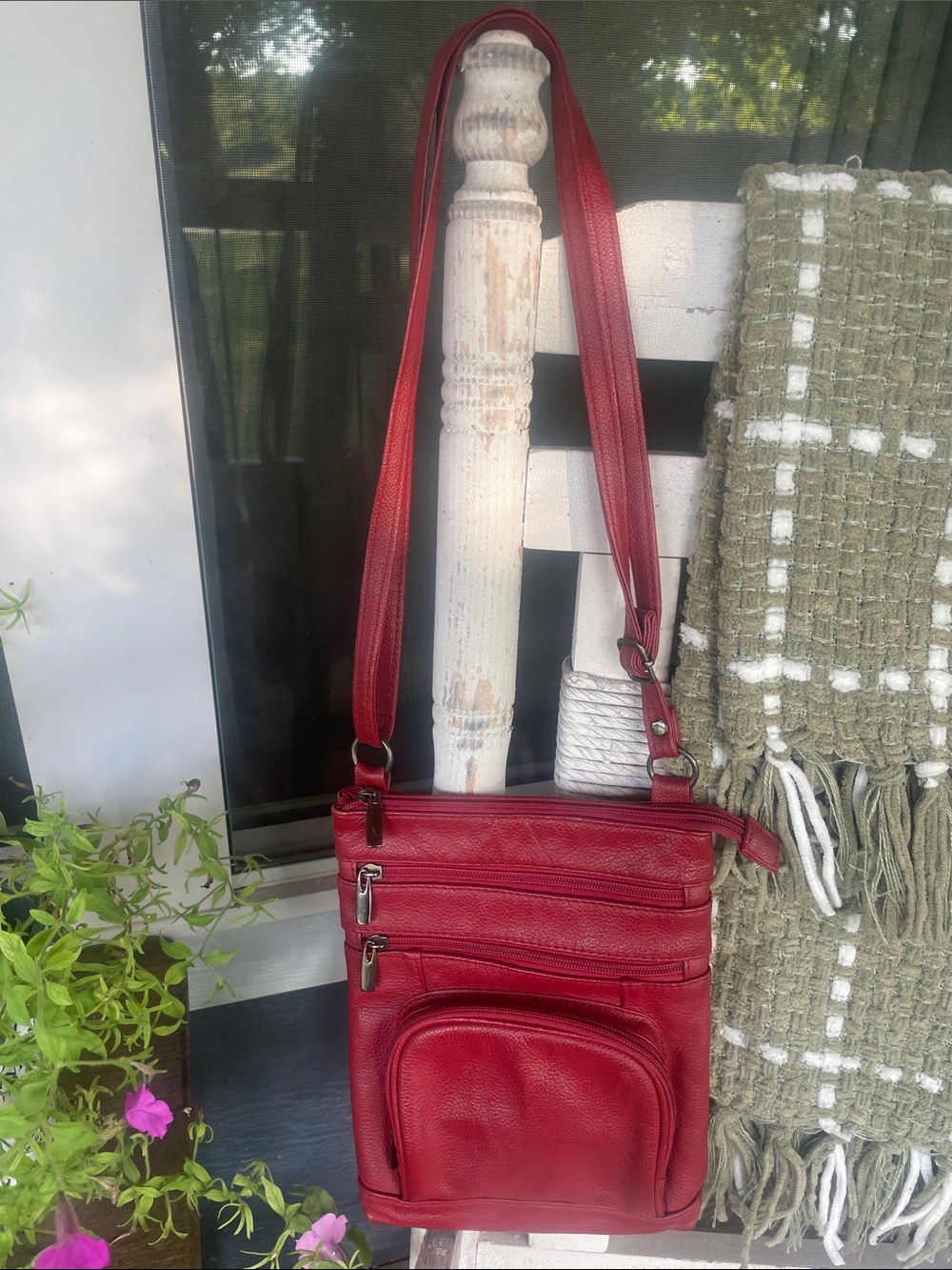 Compact Red Leather Crossbody Bag with Multiple Zip Pockets